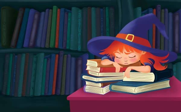 little witch Wikcy is asleep on top of books, tired from learning the new spells.